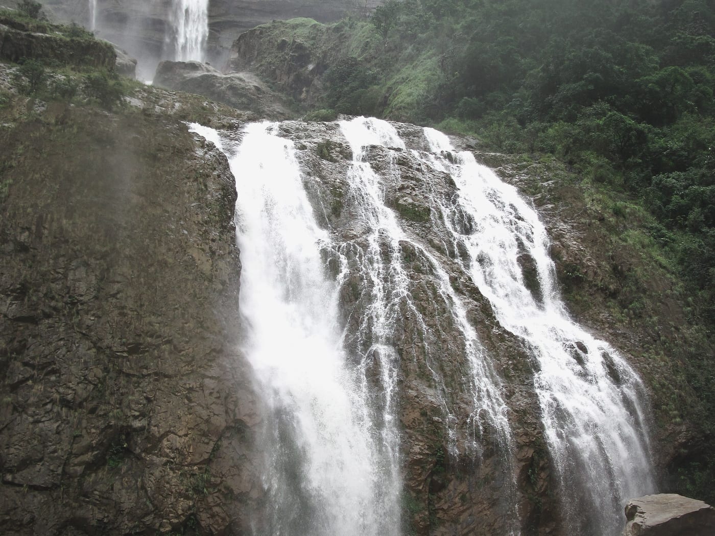 Standing at the base of Kynrem Falls' lower tiers in full monsoon flow