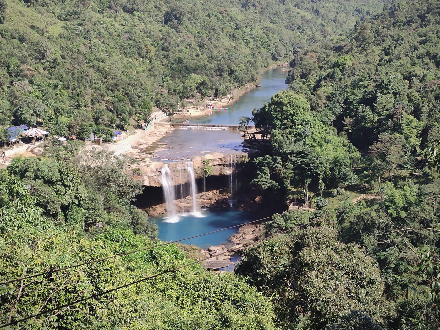 Krang Suri Falls pouring into its famous blue pool in the Jaintia Hills